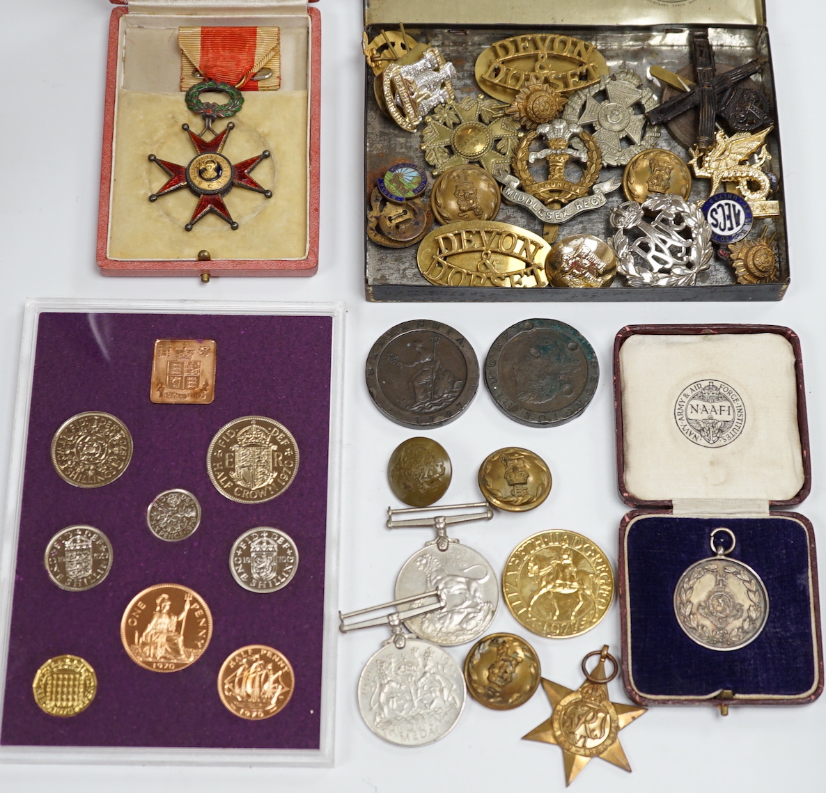 A collection of medals and coins including; an original card Air Ministry box containing a 1939-45 star and a 1939-45 medal in their greaseproof envelopes, together with a further Defence medal, a 1939-45 medal, a cased